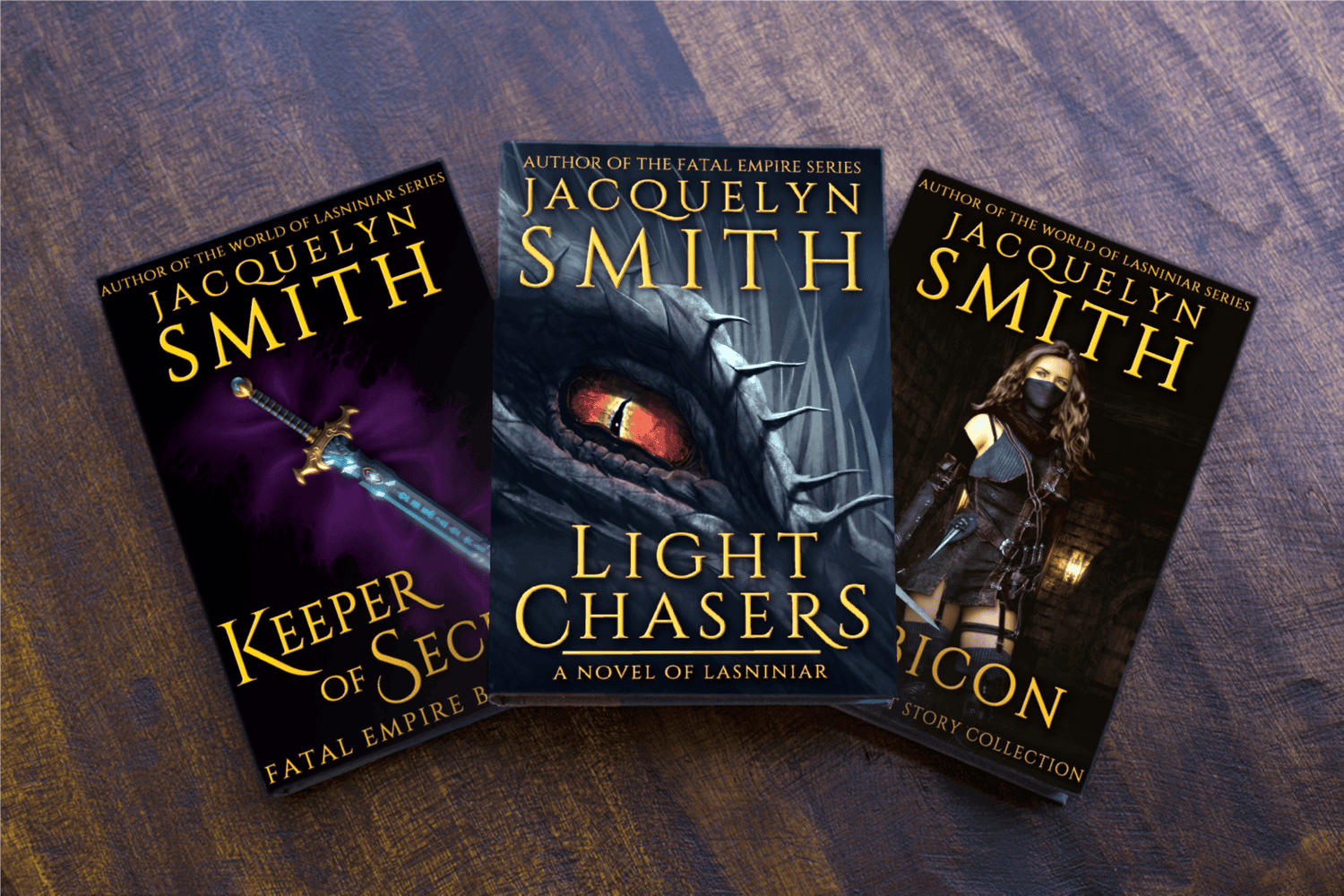 Light Chasers, Keeper of Secrets, Rubicon fantasy paperbacks on a wooden table